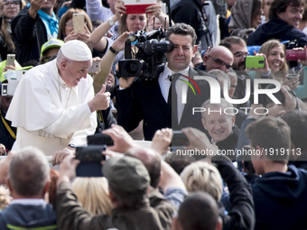 Pope Francis gives the thumbs up sign as he leaves St. Peter's Square during the weekly general audience at the Vatican, Wednesday, April 26...