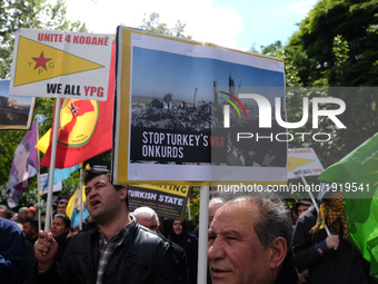 Members of London's Kurdish community protest in London, on April 26, 2017 against the Turkish military's airstrikes in Kurdistan. (