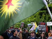 Members of London's Kurdish community protest in London, on April 26, 2017 against the Turkish military's airstrikes in Kurdistan. (