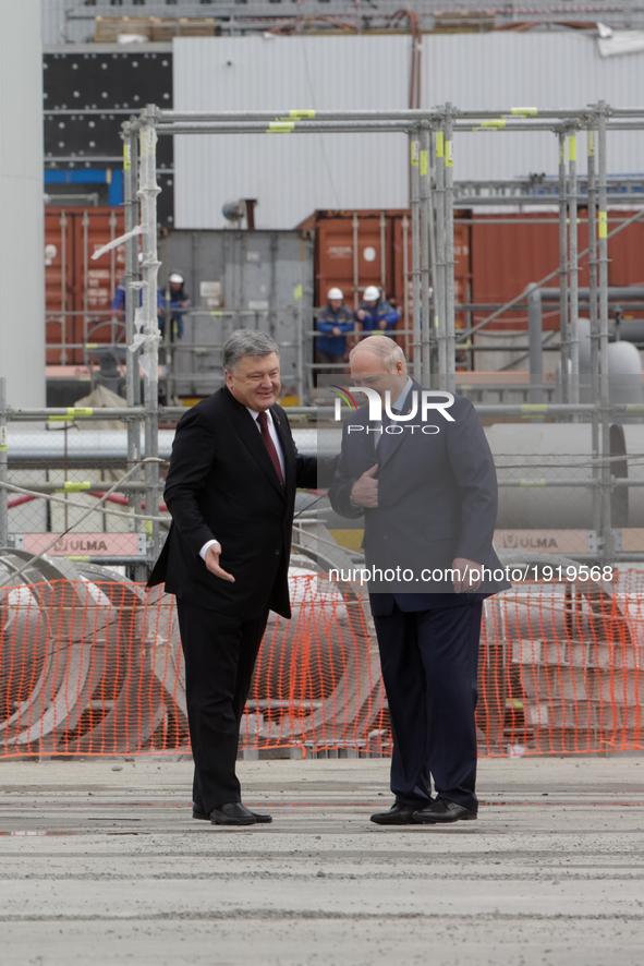 President of Ukraine Petro Poroshenko (L) and Belarus Alexander Lukashenko walk in front of the Chornobyl NPP newly raised safe confinement...