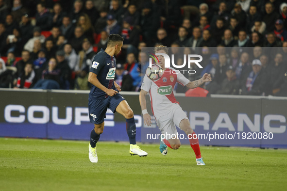 Monaco's French forward Irvin Cardona (R) vies with Paris Saint-Germain's Brazilian defender Marquinhos (L) during the French Cup semi-final...
