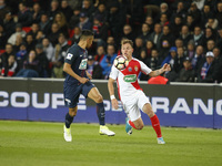 Monaco's French forward Irvin Cardona (R) vies with Paris Saint-Germain's Brazilian defender Marquinhos (L) during the French Cup semi-final...
