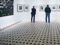 Visitors looking at pictures by US photographer Gordon Parks at the exhibition: The Camera Is My Weapon, in Zacheta - the National Gallery o...