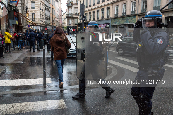 French gendarmes stand in a street during a demonstration of students protesting against the results of the first round of the French presid...