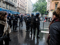 French gendarmes stand in a street during a demonstration of students protesting against the results of the first round of the French presid...