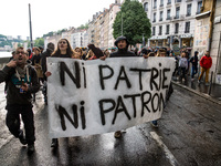 Students hold a protest banner during a demonstration against the results of the first round of the French presidential election on April 27...
