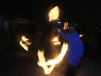 Indonesian Muslims playing with fire during celebrations welcoming Eid Al-Fitr on July 27, 2014 in Yogyakarta, Indonesia. Muslims will celeb...