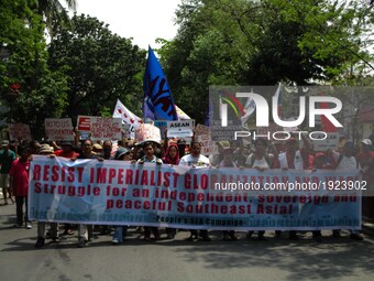 Protesters march towards the venue of the Association of Southeast Asian Nations (ASEAN) Leaders' Summit during a rally in Manila, Philippin...