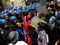 Police block protesters from reaching the venue of the Association of Southeast Asian Nations (ASEAN) Leaders Summit during a rally in Manil...