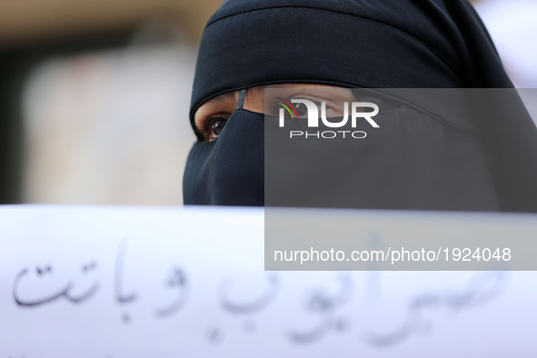 Palestinian woman hold placards during a protest demanding end an Israeli blockade of the Gaza Strip, at Al-Shifa hospital in Gaza City on A...