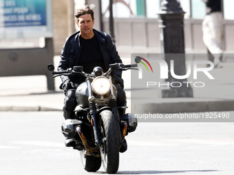 Actor Tom Cruise is seen riding a BMW bike on the set of 'Mission Impossible 6 Gemini' on Avenue de l'Opera on April 30, 2017 in Paris, Fran...