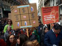 A placard like a tic-tac-toe game in which the 'Rebellious France' movment wins against money and Front National (far-right party of candida...