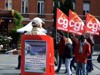 A man distributes leaflets for the raelist movement (it's described as a sect) during the May Day rally. More than 10 000 people took o the...