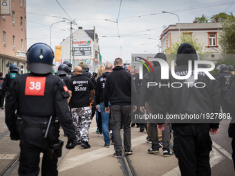 Neonazis get escorted by the police after the demonstration during a demonstration blocked in Halle, Germany, on 1st May 2017.  The far righ...