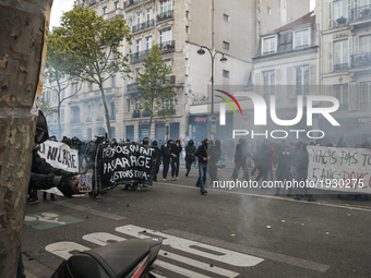 Black Block Protesters march engage police authorities with smoke flares and fireworks during the 1st of May marches  in Paris on May, 1th,...