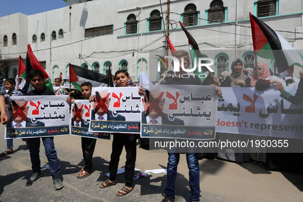  Palestinian kids hold signs as supporters of Hamas, Jihad Islamic and Al Ahrar movement gather to protest against President of the State of...