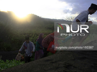 Indonesian Muslims gathered at the sand dunes to the Eid prayer in Parangkusumo on July 28, 2014 in Yogyakarta, Indonesia. Eid marks the end...