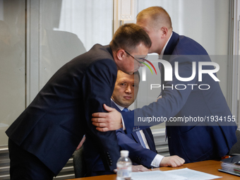 Viktor Yanukovych (not present) defenders put heads together during the court hearing. Obolon district court of Kyiv starts the preliminary...
