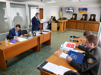 Viktor Yanukovych (not present) defender Vitalii Serdyuk (2nd L) has a speech during the court hearing. Obolon district court of Kyiv starts...