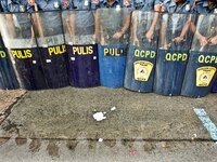 Quezon City, Philippines - Riot police prepare for protesters during the President's State of the Nation Address (SONA) held in Quezon City...