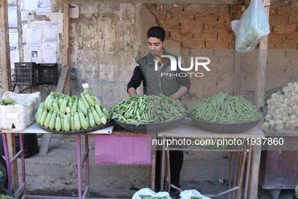 A Syrian vendor in the rebel-held town of Douma, on the eastern outskirts of the Syrian capital Damascus, on 6 May 2017 after the signing of...