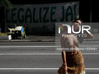 (EDITORS NOTE: Image contains nudity.)  A woman poses during a march calling for the legalization of marijuana along Paulista Avenue in Sao...