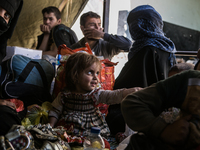 A family fleeing Mosul rests in a civilian collection center as fighting between Iraqi forces and the Islamic State intensifies on May 8th,...