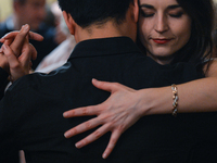 A couple of dancers perfoms Argentine tango during an evening milonga event in Juliusz Slowacki Theatre, an event that was a part of Krakus...