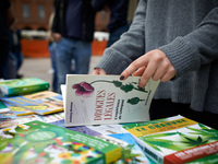 A woman takes alook at a book titled 'Legal drugs: the experience of Liverpool'. For the Global Marijuana March, supporters of legalization...