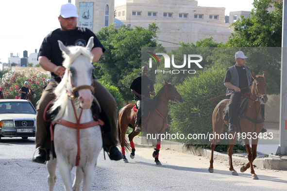 Demonstrators take part in a march  for horse rider in support of hunger striker Palestinian prisoners in Israeli jails, from Es-sheikh Acli...