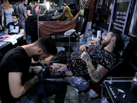 A man with gets a tatoo at Athens International Tatoo Convention, at the Olympic Tae Kwon Do Centre, on Saturday May 13, 2017. The visitors...