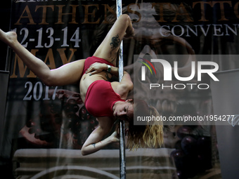 Pole duncing during Athens's International Tatoo Convention, at the Olympic Tae Kwon Do Centre, on Saturday May 13, 2017. The visitors of th...