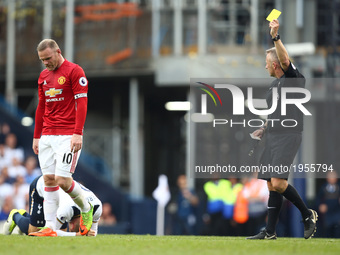 Manchester United's Wayne Rooney gets is shown a yellow card by Jonathan Moss
during Premier League match between Tottenham Hotspur and Manc...
