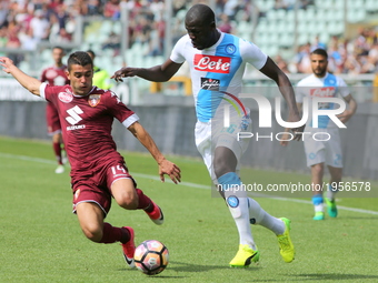 Kalidou Koulibaly (SSC Napoli) and Iago Falque (Torino FC) compete for the ball during the Serie A football match between Torino FC and SSC...