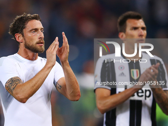 
Claudio Marchisio and Mario Mandzukic of Juventus greeting the supporters at Olimpico Stadium in Rome, Italy on May 14, 2017.
 (