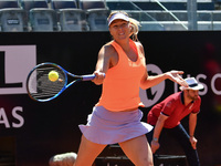 Maria Sharapova of Russia stretches for a return during her second round match against Christina McHale of USA on Day Two of The Internazion...