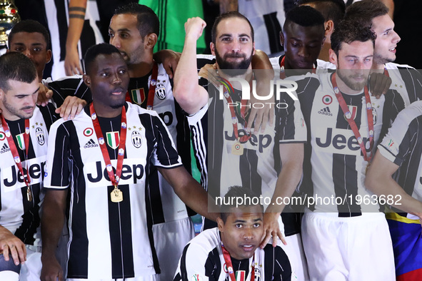 Gonzalo Higuain of Juventus celebrates the Coppa Italia victory after the final between Juventus FC and SS Lazio at the Olympic Stadium on M...