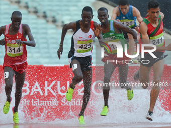 Mohamed Tindouft (Right) of Morocco controles the race in Men's 3000m Steeplechase final, during an athletic event at Baku 2017 - 4th Islami...