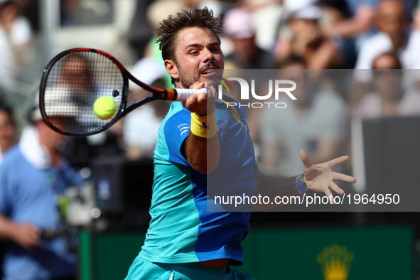 Swiss Stanislas Wawrinka returns the ball to US John Isner during their tennis match at the ATP Tennis Open tournament on May 18, 2017 at th...