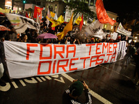 Protestors protest on Avenida Paulista, central region of Sao Paulo, Brazil, against the government of President Michel Temer, on May 18, 20...