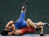 Magomed Muslimov of Azerbaijan competes against Jan Sadeed Malilk of Afganistan in the Mens Freestyle Wrestling 65kg semi-finals during day...