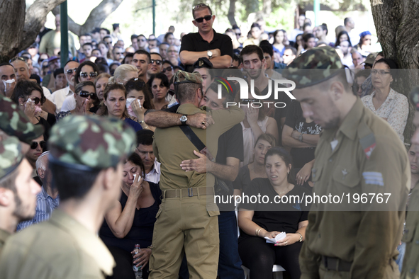 Family and relatives mourn during the funeral of Daniel Kedmi, an infantry soldier, training to be a squad commander, during his funeral at...