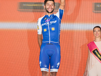 Colombian Fernando Gaviria, of the Quick Step team, celebrates on the podium after winning the 13th stage of the 100th Giro d'Italia, Tour o...