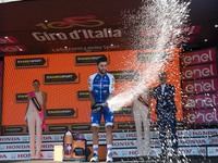 Colombian Fernando Gaviria, of the Quick Step team, celebrates on the podium after winning the 13th stage of the 100th Giro d'Italia, Tour o...