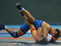 Ikhtiyor Navruzov of Uzbekistan competes against Mostafa Hosseinkhani of Iran in the Mens Freestyle Wrestling 70kg quarter-finals during Bak...