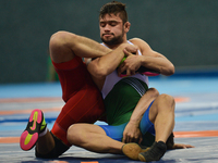 Alibek Osmonov of Kyrgyzstan competes against Abdul Wahab of Pakistan in the Mens Freestyle Wrestling 61kg semi-finals during Baku 2017 - 4t...