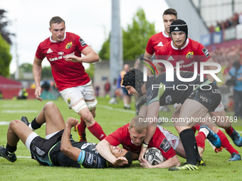 Keith Earls of Munster with Keelan Giles and Dan Evans of Ospreys during the Guinness PRO12 Semi-Final match between Munster Rugby and Ospre...