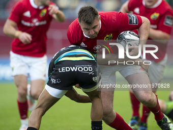 Niall Scannell of Munster tackled by Keelan Giles of Ospresy during the Guinness PRO12 Semi-Final match between Munster Rugby and Ospreys at...