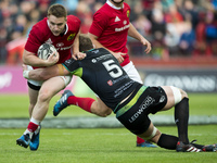 Rory Scannell of Munster tackled by Alun Wyn Jones of Ospreys during the Guinness PRO12 Semi-Final match between Munster Rugby and Ospreys a...