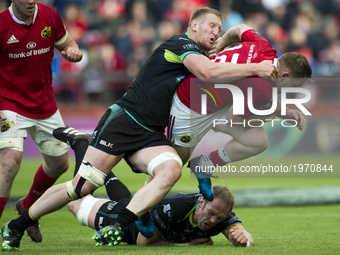 Rory Scannell of Munster tackled by Bradley Davies of Ospreys during the Guinness PRO12 Semi-Final match between Munster Rugby and Ospreys a...